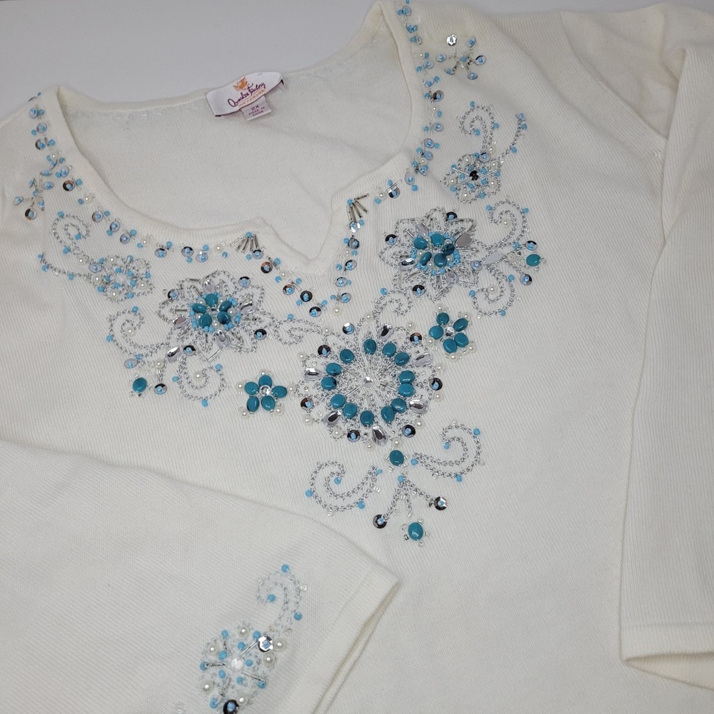 White Embellished V-Neck Sweater with Blue Accents